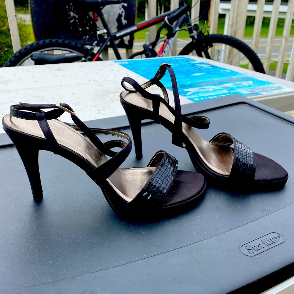 Black 4” tall high heels. Sparkly and strappy, and oh so sexy.